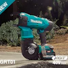 Makita 40V cordless power tool on concrete with battery, surrounded by plants