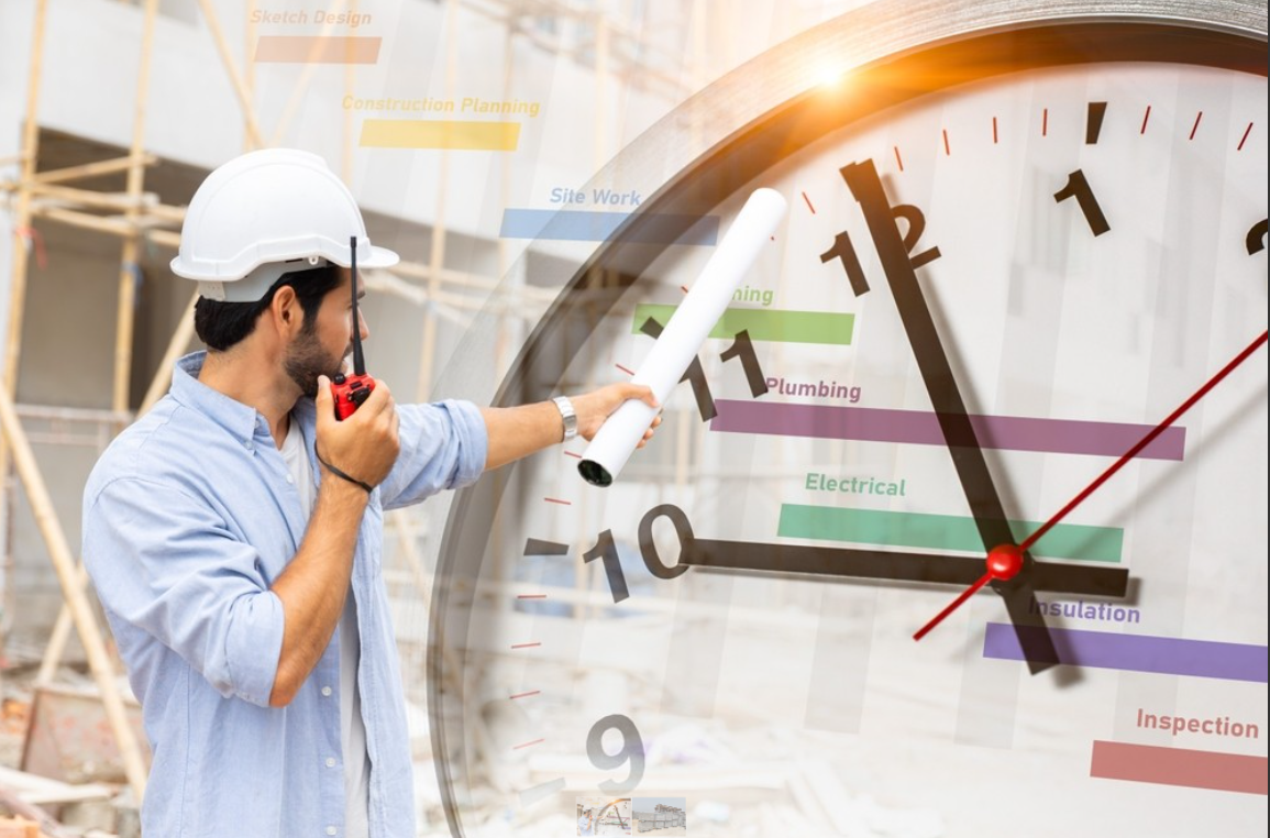 Construction manager checking time on project timeline clock at building site
