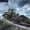 Military green wheel loader climbing rocky terrain under dramatic cloudy sky