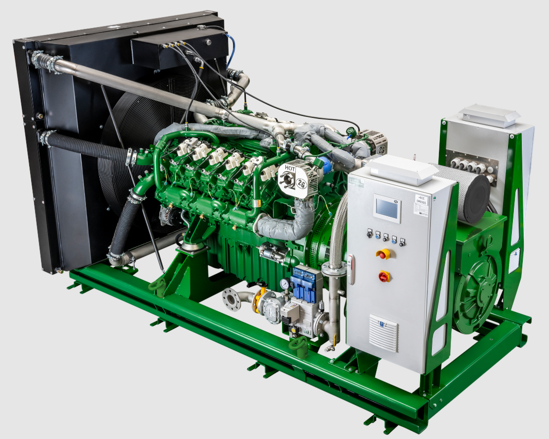 Green and silver industrial generator with complex mechanical engine and control panel