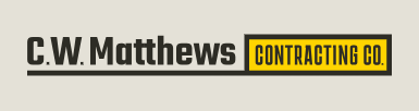 C.W. Matthews Contracting Company logo in black, white, and yellow