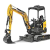Yellow and black compact excavator with articulated arm and tracked base on white background