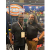 Two professionals at PLS Portable Lighting Solutions trade show booth