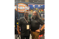 Two professionals at PLS Portable Lighting Solutions trade show booth