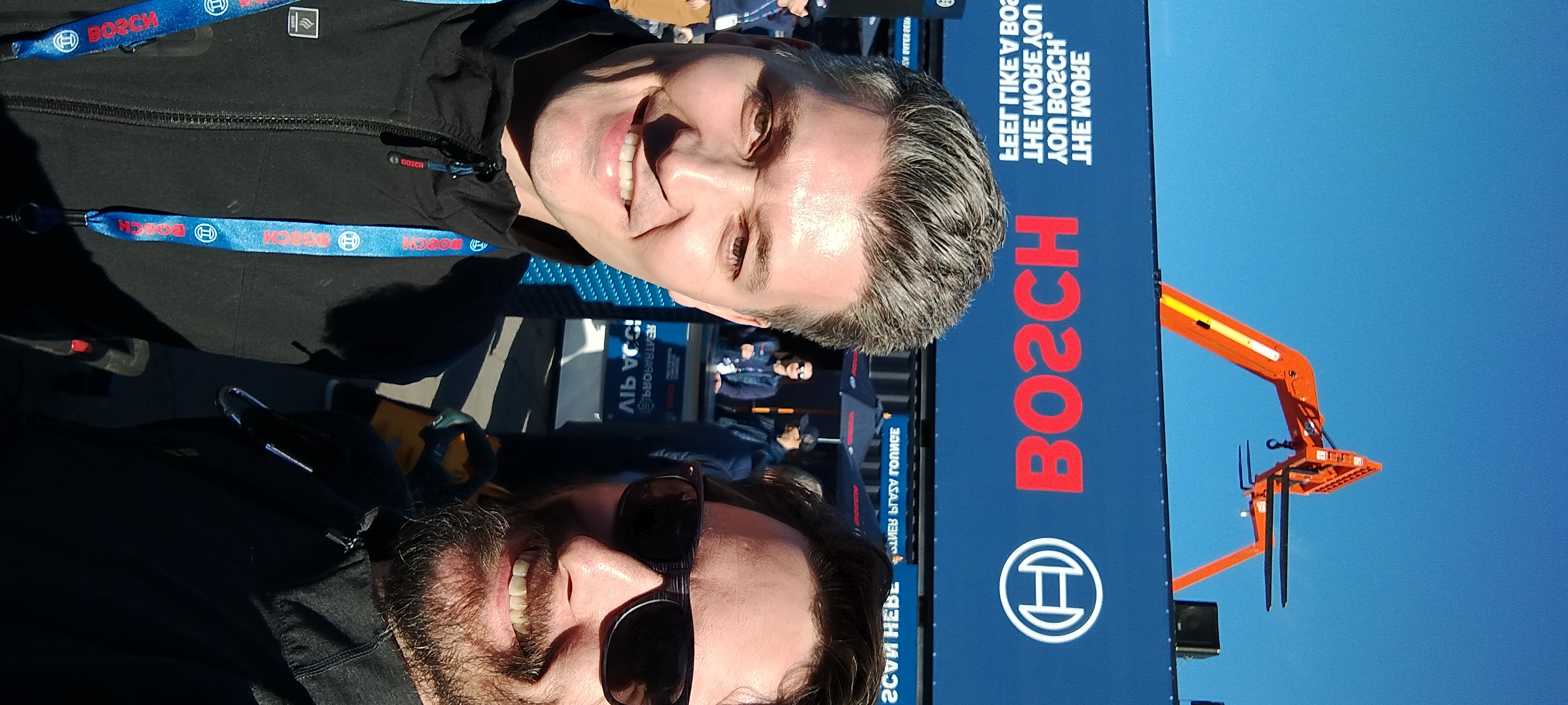 Two smiling professionals at Bosch event