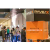 PAVEX conference booth with orange and black branding displays