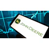 John Deere logo displayed on smartphone with financial market graph backdrop