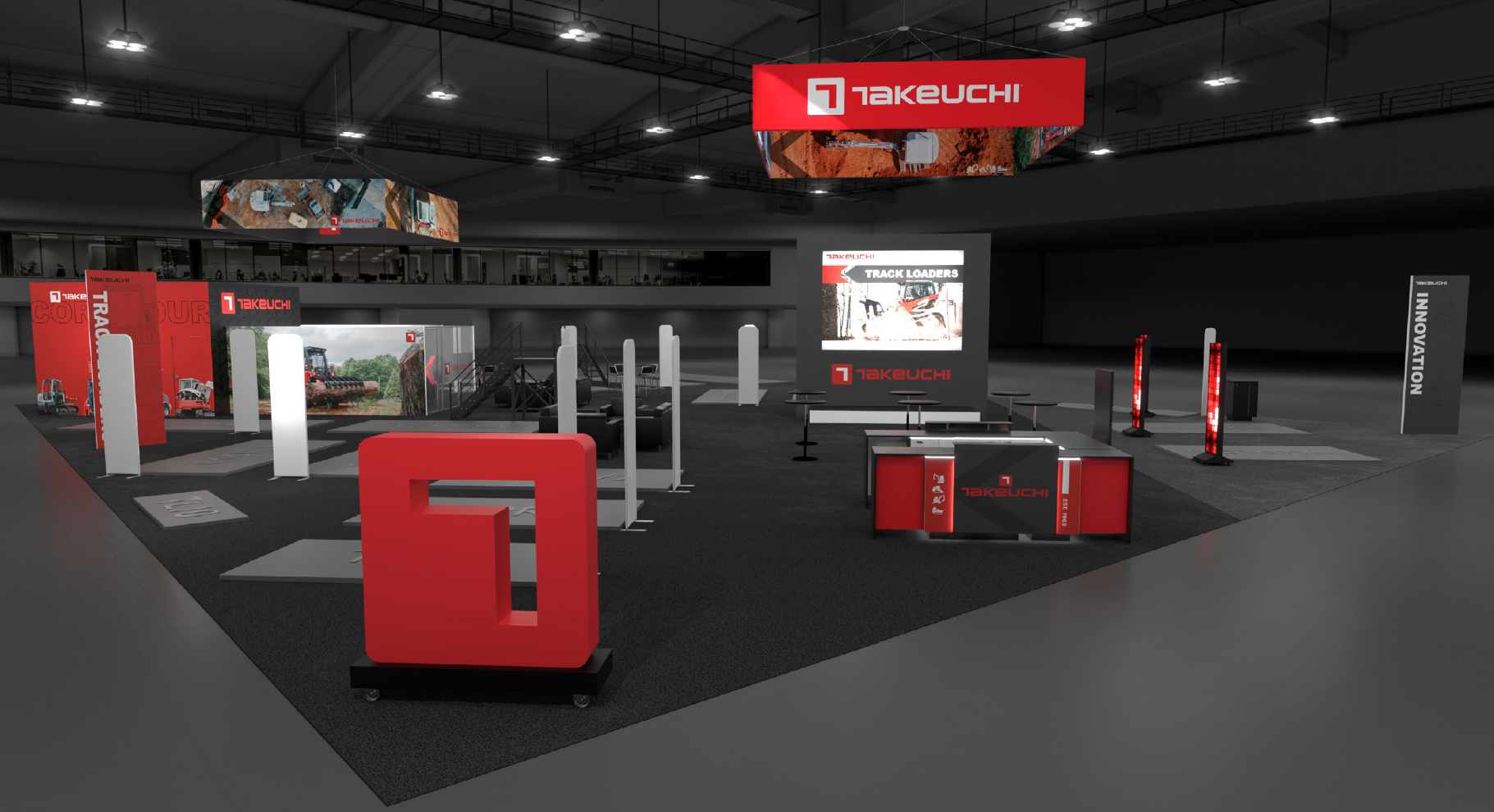 Takeuchi industrial equipment trade show booth with red and black display panels