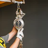 Safety fall arrest device with carabiner attached to overhead mounting