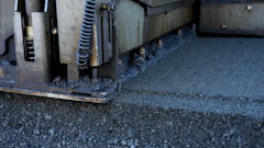Industrial machinery edge with metal components and textured surface
