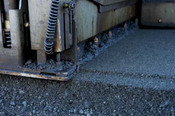 Industrial machinery edge with metal components and textured surface