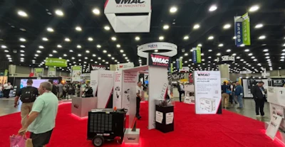 VMAC industrial trade show booth with red carpet and display stands
