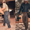 Two construction workers in rugged workwear near utility vehicle and lumber pile