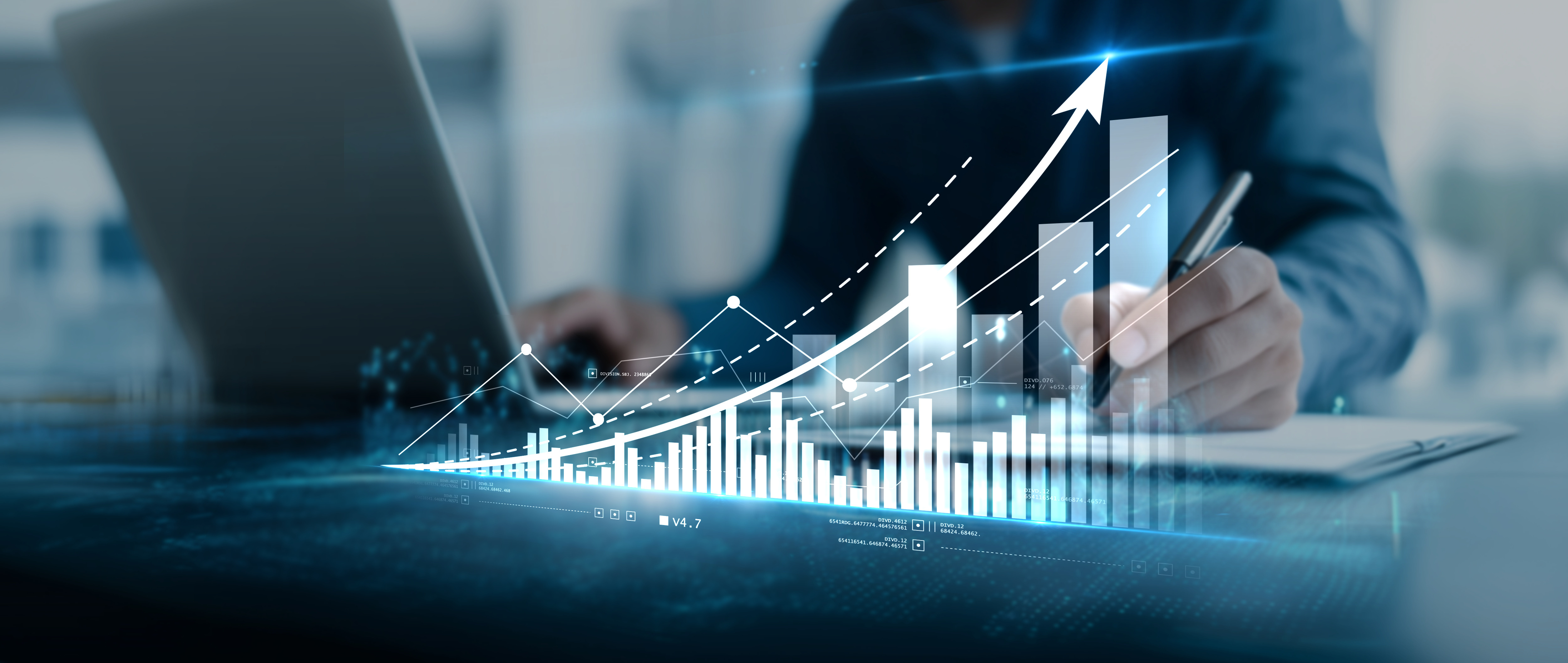 Business professional analyzing financial growth charts with upward trending arrows and bar graphs on digital display