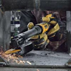 DeWalt angle grinder in use cutting metal with sparks in industrial workshop setting