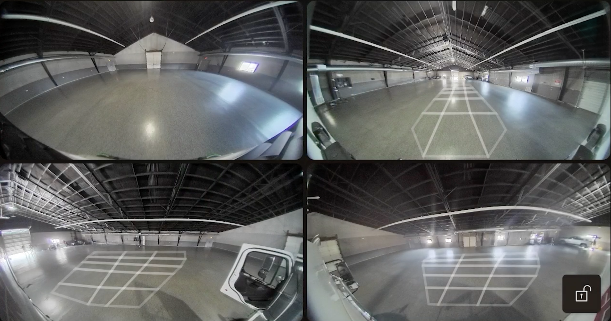 Four-panel security camera feed of industrial warehouse interior with polished concrete floors and metal ceiling structure