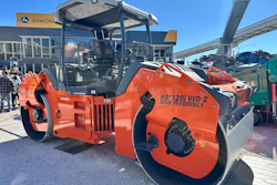 Orange Hamm HD120i VIO-2 vibratory roller compactor on display at outdoor equipment dealership