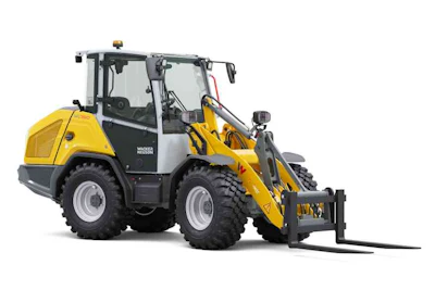 Yellow and black Wacker Neuson wheel loader with front-mounted pallet fork attachment on white background