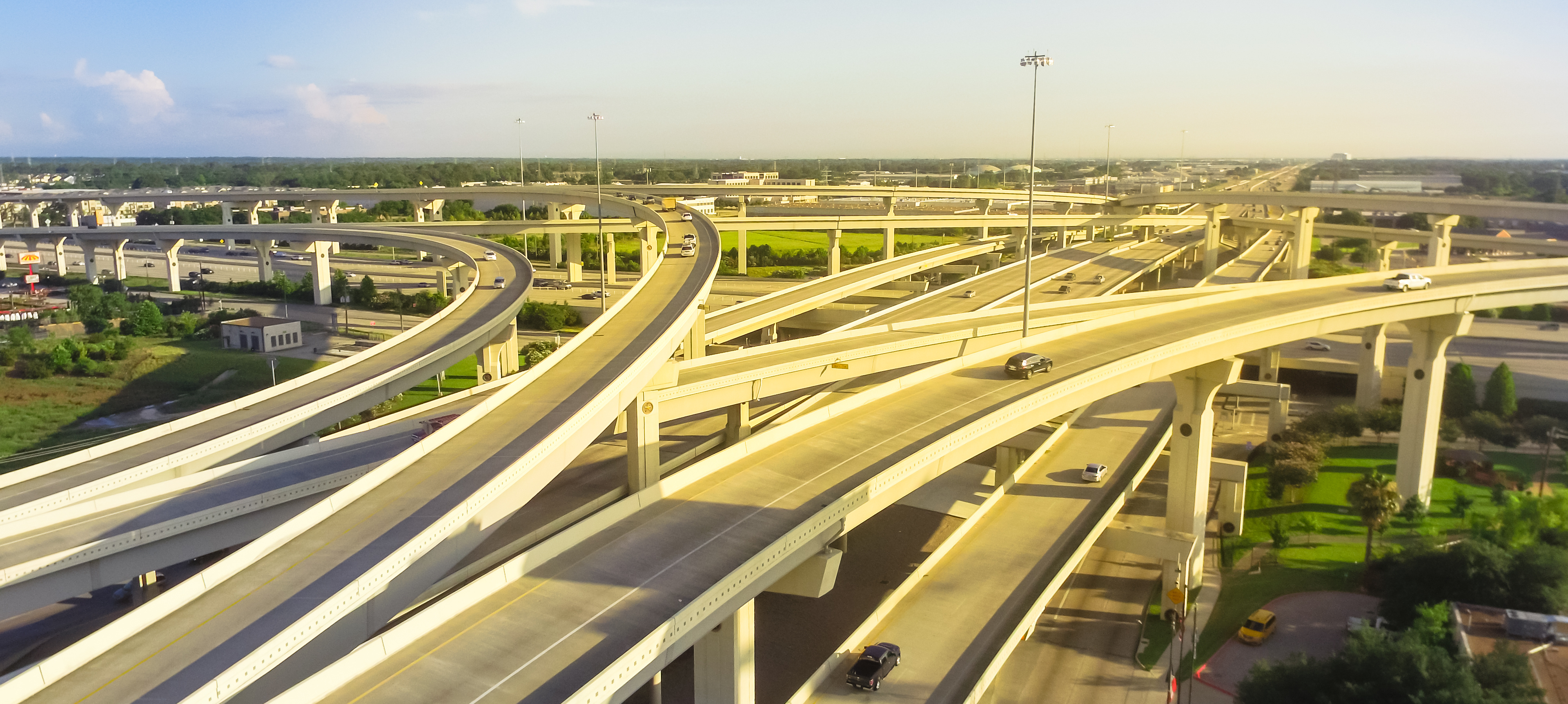 Panorama horizontal aerial view massive highway intersection, stack interchange blue sky in Houston, Texas, USA.