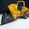 Yellow and black Vermeer wood chipper machine with hopper and collection bin on white background
