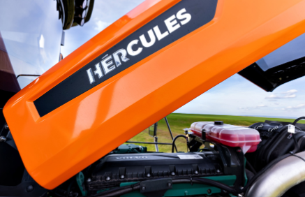 Hercules tractor hood with white text branding on orange metal surface