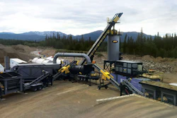 Mobile aggregate processing plant with conveyor systems and heavy equipment in mountainous terrain