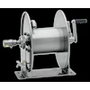 Industrial hose reel with dual flanged wheels, central drum, electric motor, and manual crank handle mounted on base