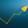 Yellow paper airplane ascending along an upward trending line graph on blue background