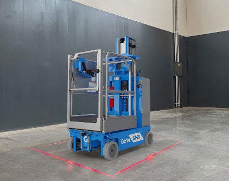 Blue Genie scissor lift with red safety markings on concrete floor in industrial warehouse