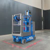 Blue Genie scissor lift with red safety markings on concrete floor in industrial warehouse