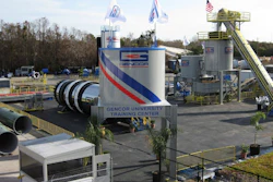 Gencor University Training Center industrial facility with blue and red striped branding, equipment towers, and flags