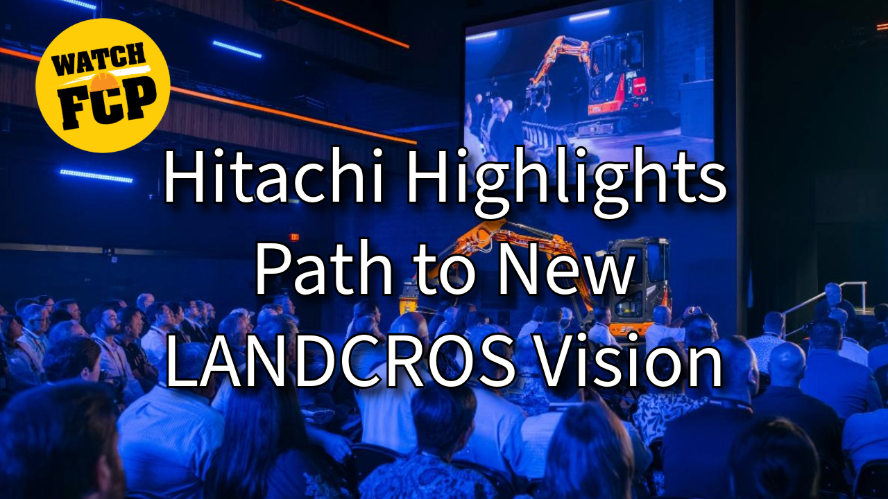 Hitachi industrial event presentation featuring robotic arm demonstration and audience in blue-lit venue with 'Watch FCP' branding