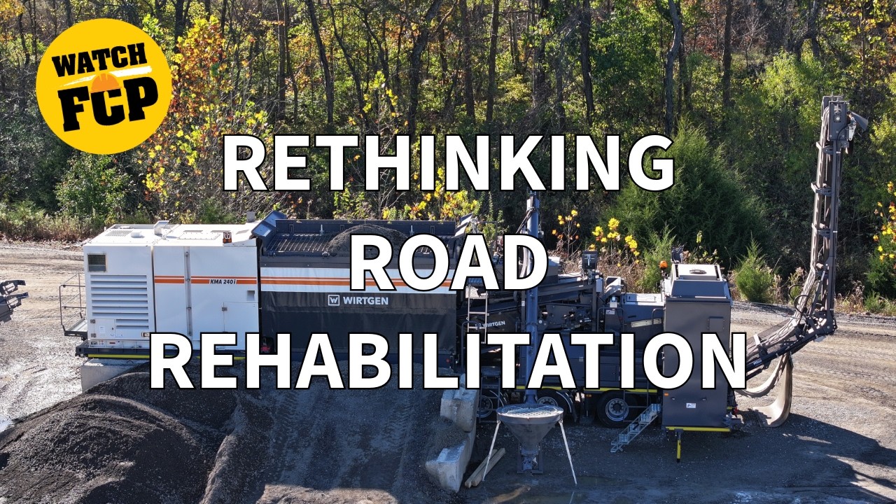 Road rehabilitation equipment with asphalt paving machinery in forest setting, promoting rethinking road rehabilitation