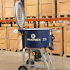 Makinex trowel holder mixer displayed in warehouse with wooden shipping crates