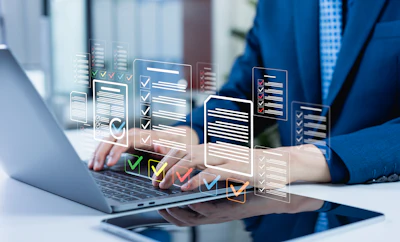 Professional in blue suit using laptop with holographic checklist and task management interfaces floating above keyboard