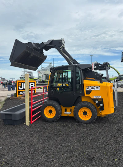Yellow and black JCB L250 telehandler with raised bucket attachment at equipment dealership