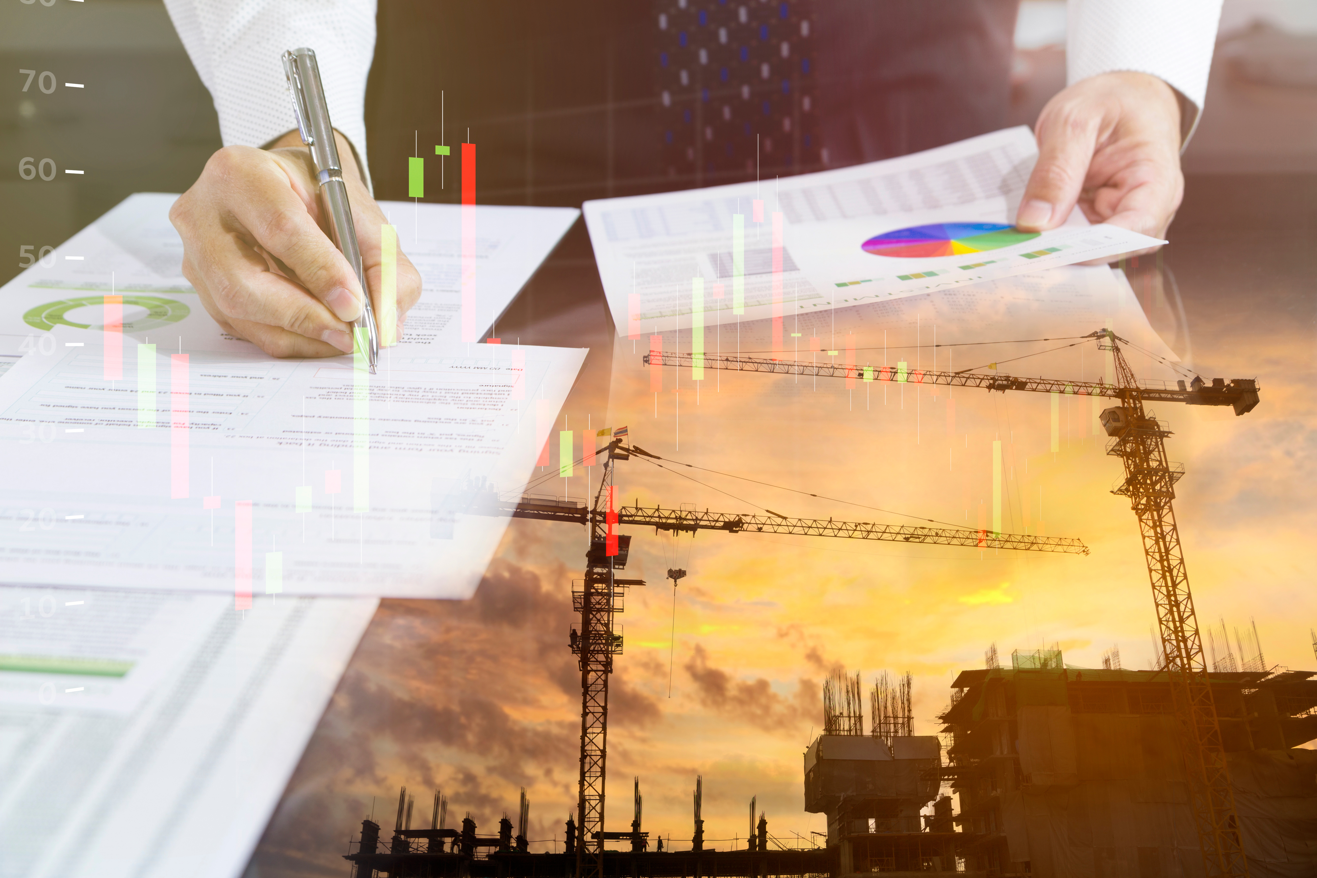Business professional analyzing financial charts and construction project data with colorful graphs and sunset construction site overlay