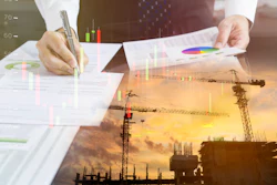Business professional analyzing financial charts and construction project data with colorful graphs and sunset construction site overlay