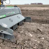 Stone RX agricultural equipment with green accents operating in a plowed field