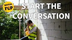 Construction worker in safety vest sitting against concrete wall with 'Watch FCP' badge overlay