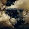 Volvo truck engulfed in dust clouds during high-speed off-road driving
