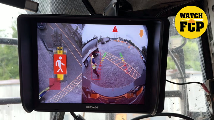 Vehicle reversing camera system display showing multi-angle parking assistance with yellow 'Watch FCP' badge