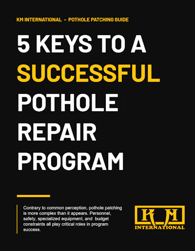 KM International logo featuring stylized K and M letters in gold on black background