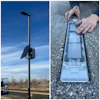 Solar panel device mounted on outdoor pole with close-up view of internal solar cell components